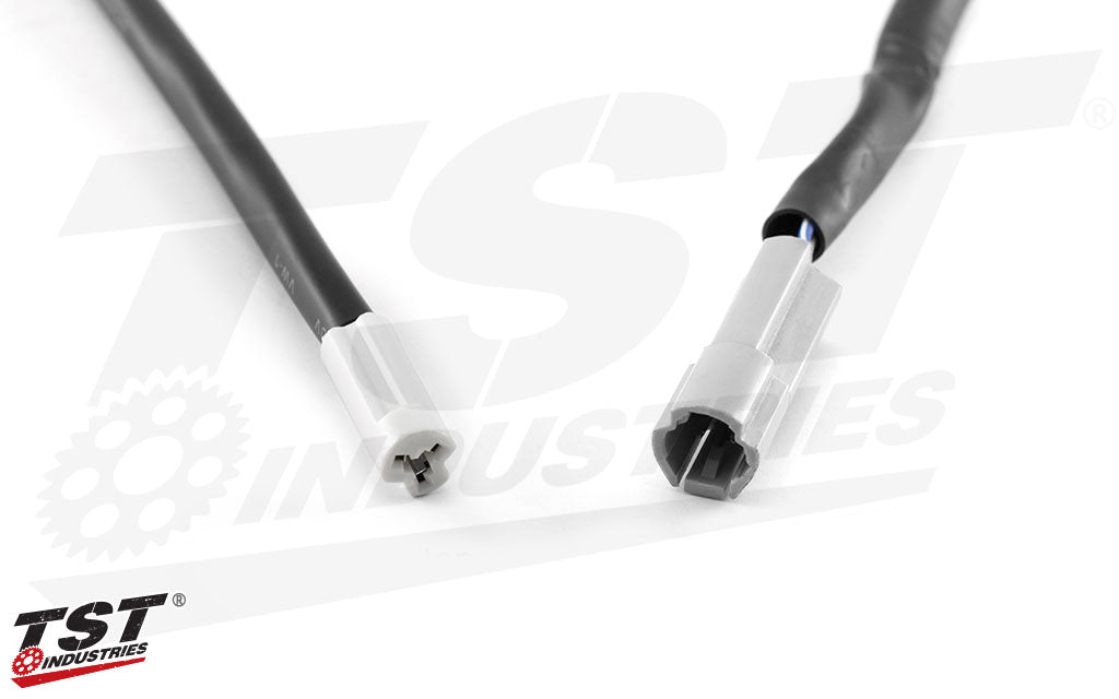 Close up view of TST converter plug and the matching OEM plug it corresponds with.