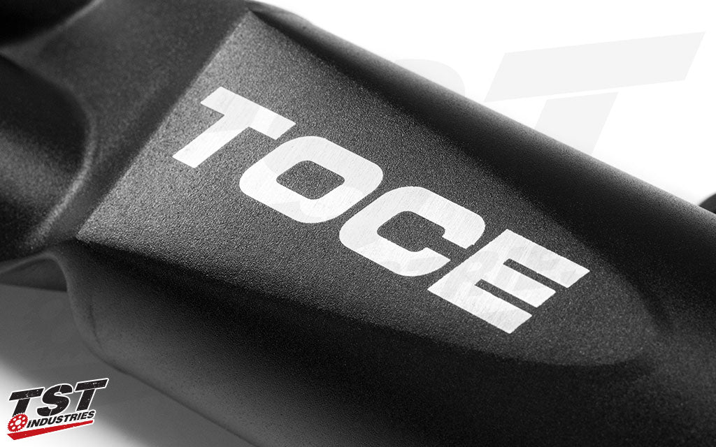 Features Toce logo on the dual outlet canister.