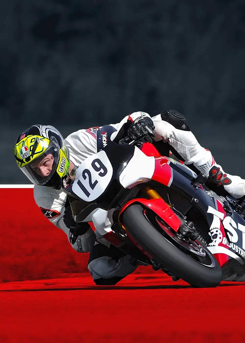 TST Industries WORX Yamaha R1 racing around the track with the rider leaning off the side of the motorcycle.