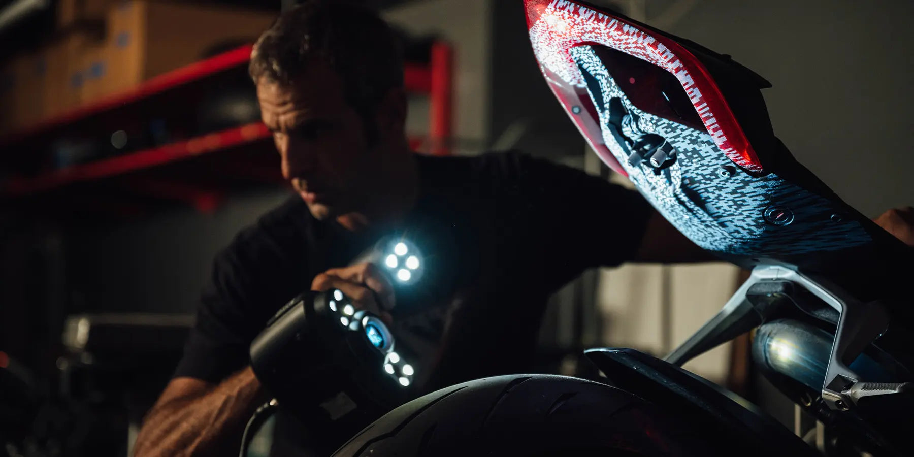 TST Industries Bart Rogowski scanning the undertail of a Ducati motorcycle for custom product development.