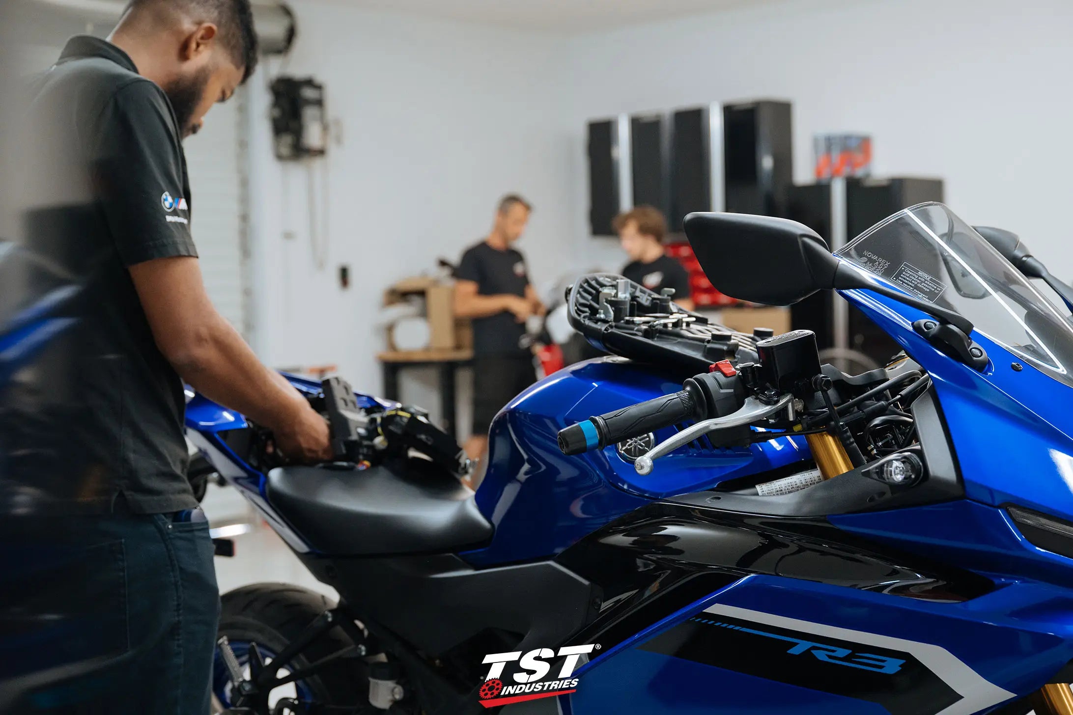 TST Industries crew tearing into the 2025 Yamaha R3 for research and development.