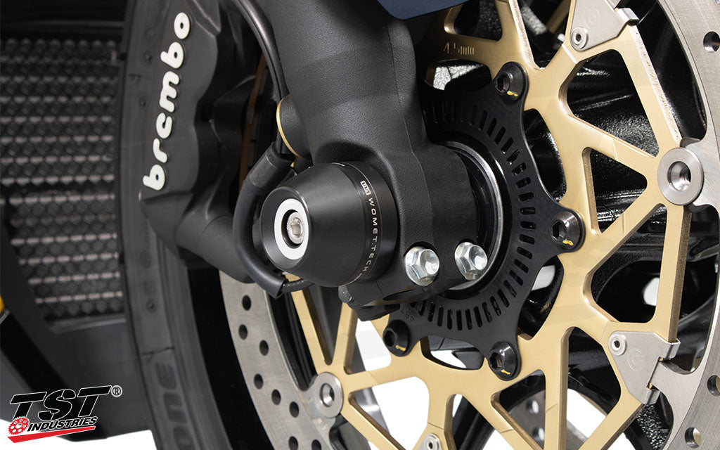 Close up view of the delrin sliders on the Womet-Tech Fork Slider Crash Protection kit.