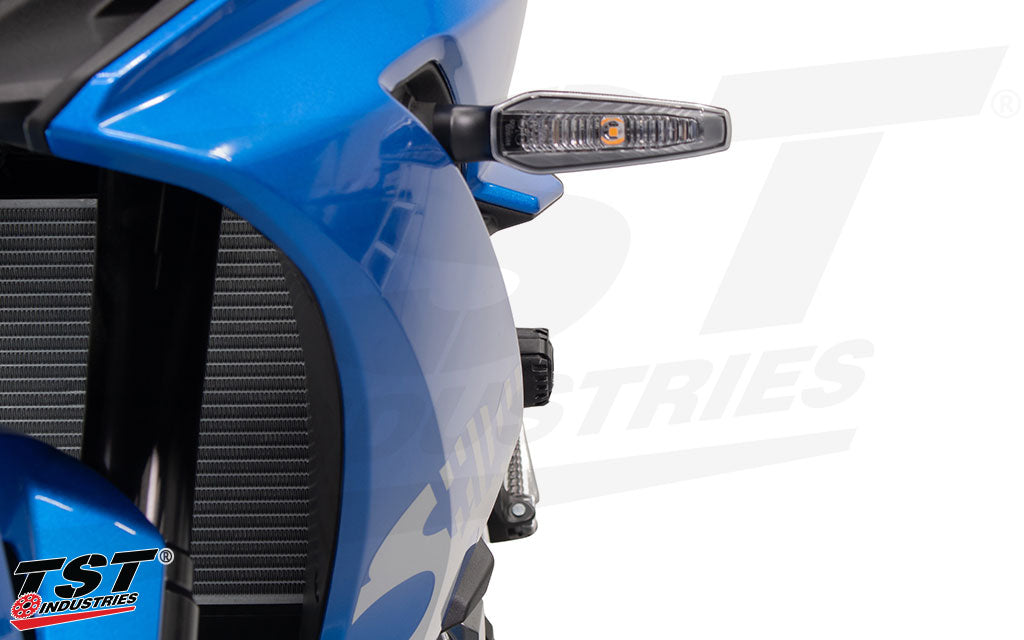 Front angle of the TST Shock Absorbing Frame Sliders installed on a Suzuki GSX-8R.