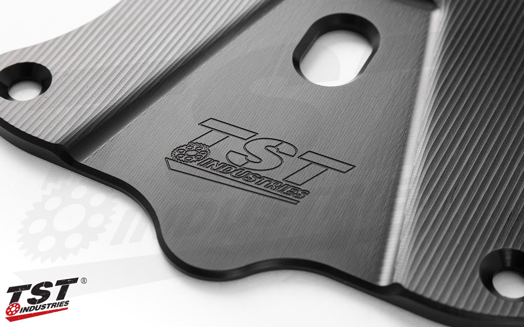 Textured to enhance the black anodized finish and features a subtle engraved TST logo.