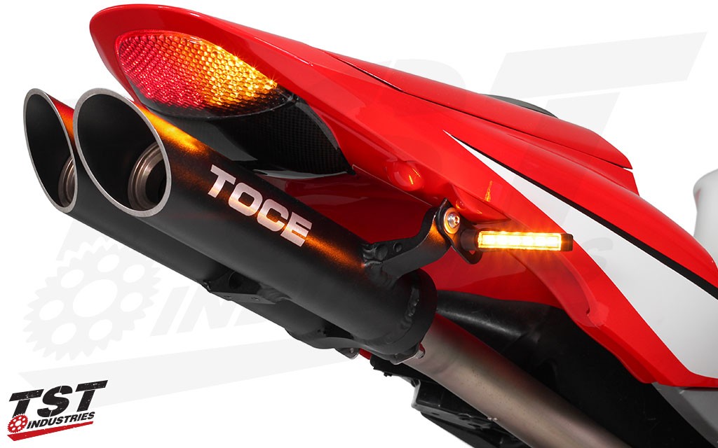 Works with most aftermarket rear turn signals. (TST Industries BL6 LED Rear Pod Turn Signals shown)