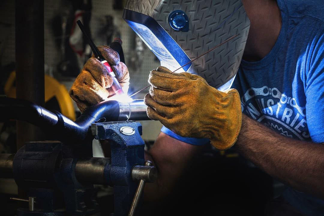 Bart welding on a subframe for a motorcycle.
