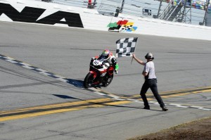 Alex Ferreira #642 crossing the finish line on the TST R3 Race Bike