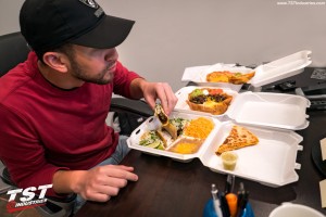 Warehouse manager Jon for TST Industries eating tacos