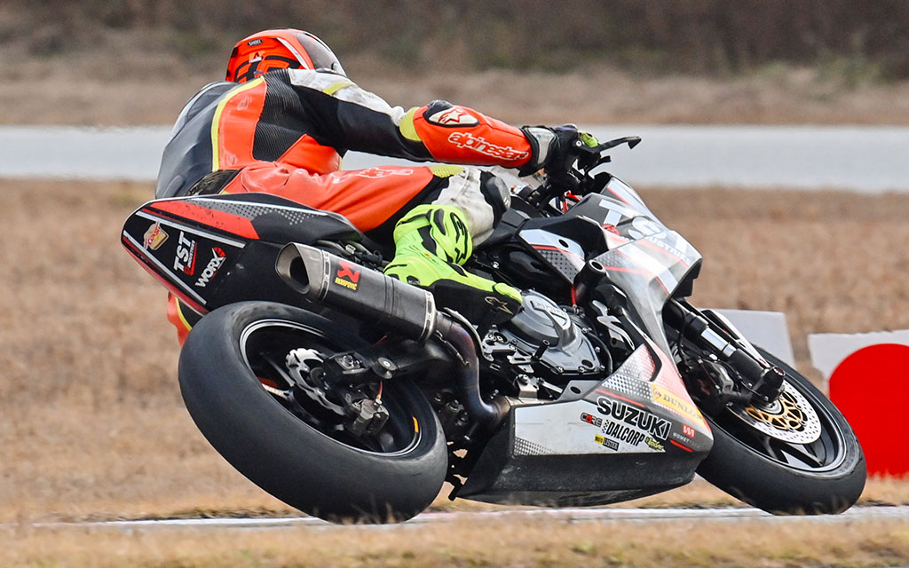 TST Industries WORX GSX-8R Race Bike leaning into a corner on the race track