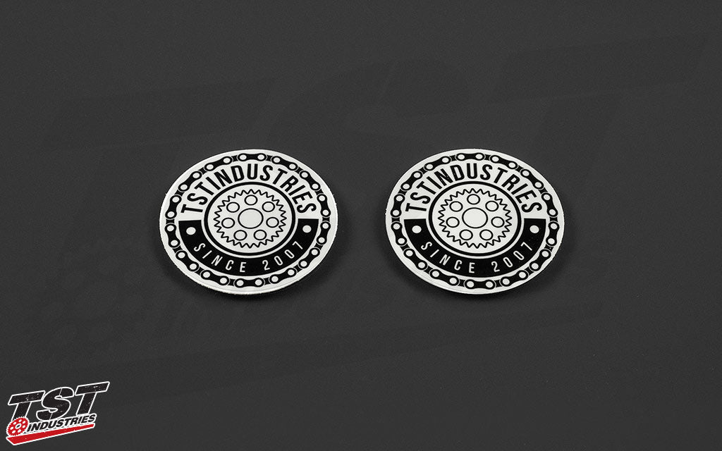 White round TST emblem sticker. Measures 2 inches in diameter.
