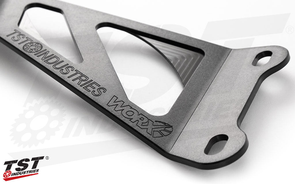 TST WORX subtle engraved iconography.