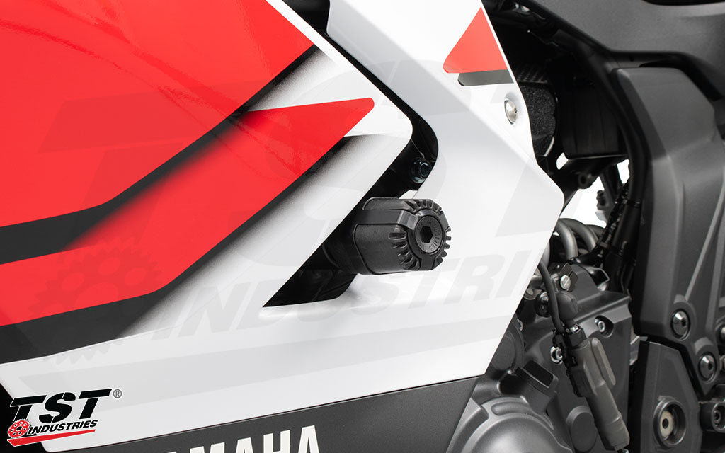 Close up image of the TST Industries Shock Absorbing Frame Sliders installed on the 2026 Yamaha YZF-R6.
