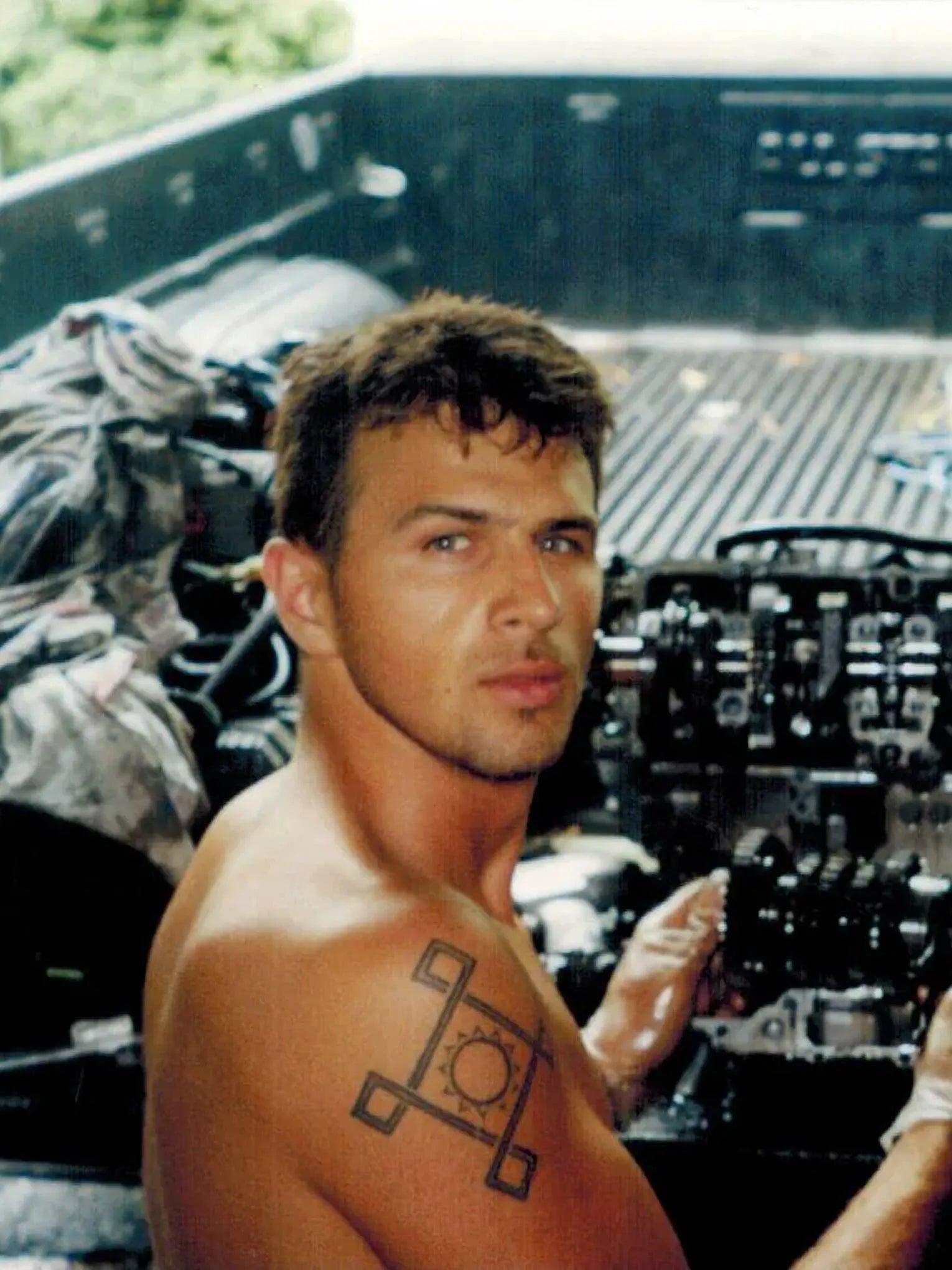 Bart Rogowski working on an engine in the early days of TST Industries.