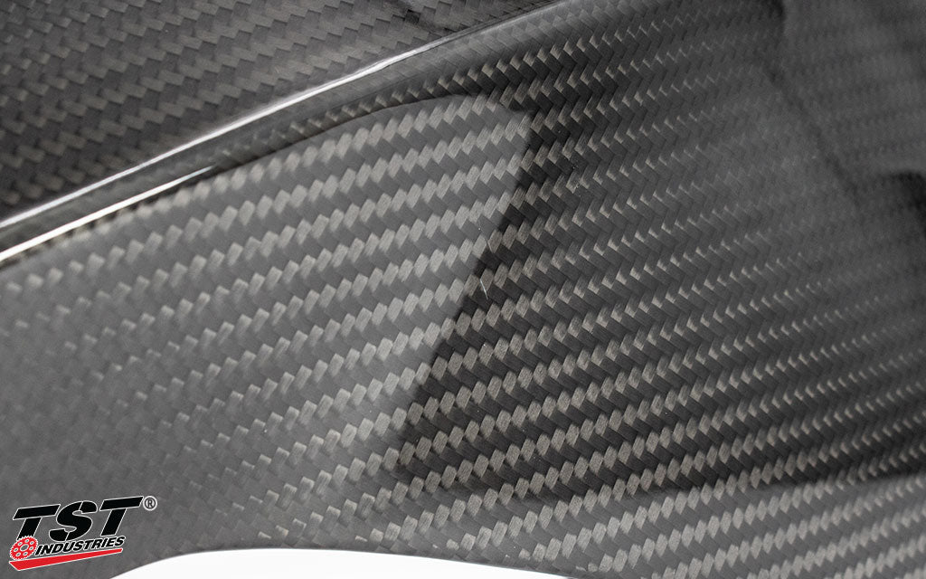 Close-up image of blemish example present on the TST WORX Carbon Fiber Tank Extender.