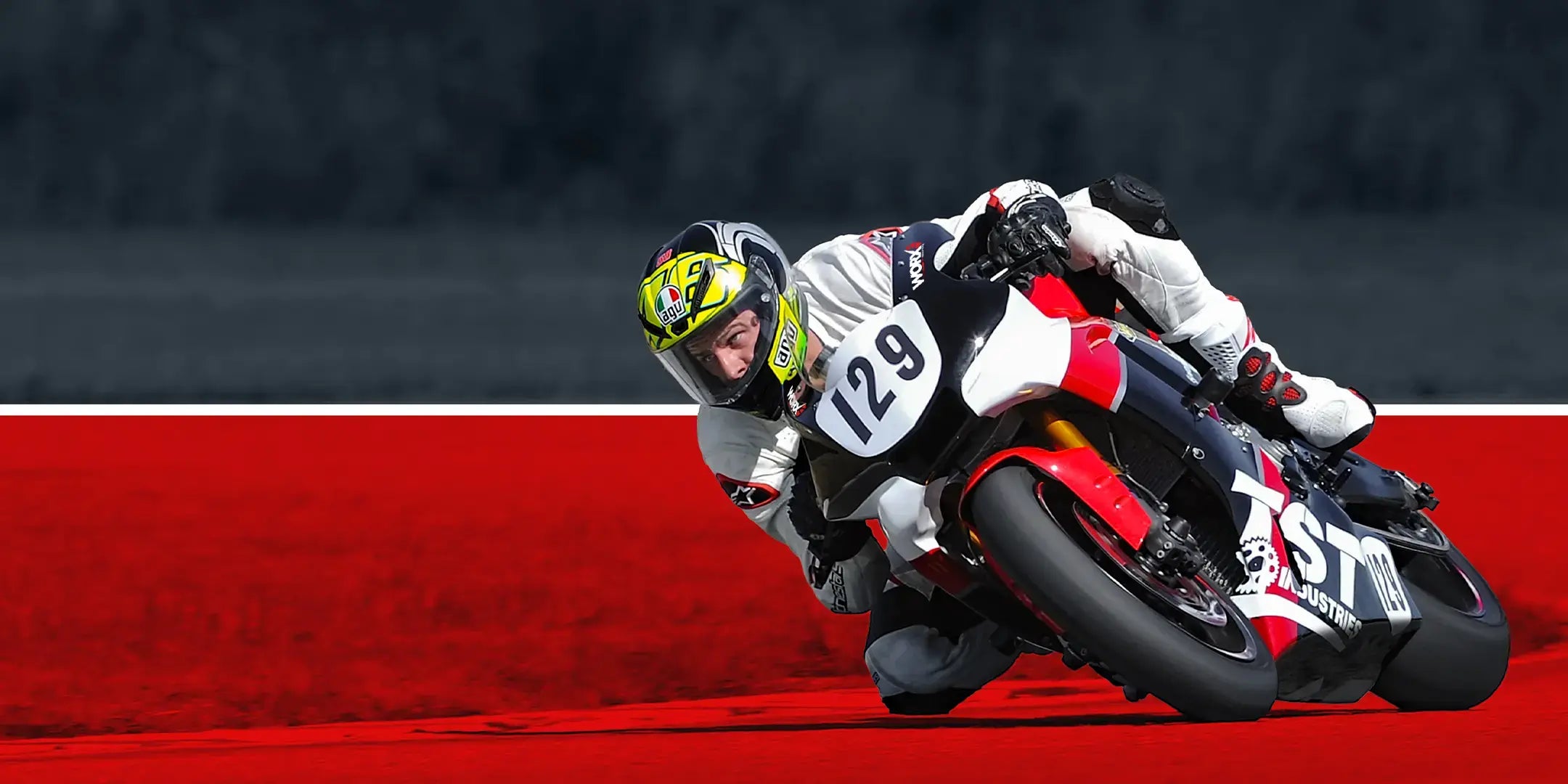 TST Industries WORX Yamaha R1 racing around the track with the rider leaning off the side of the motorcycle.