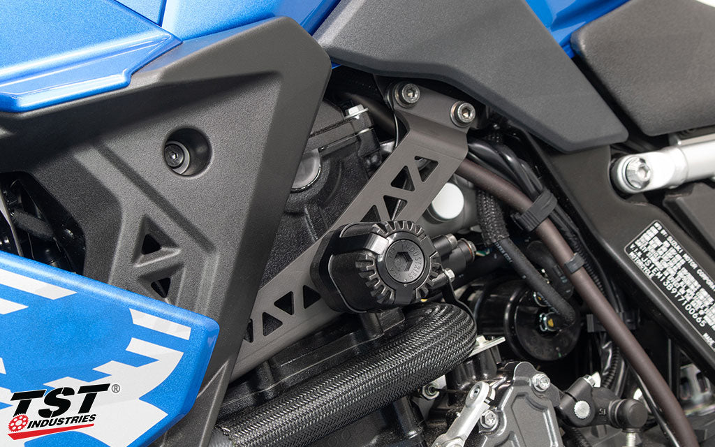 Close up view of the TST Shock Absorbing Frame Sliders installed on a Suzuki GSX-8R.