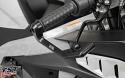 Black anodized brake lever guard shown installed on an Aprilia sportbike.