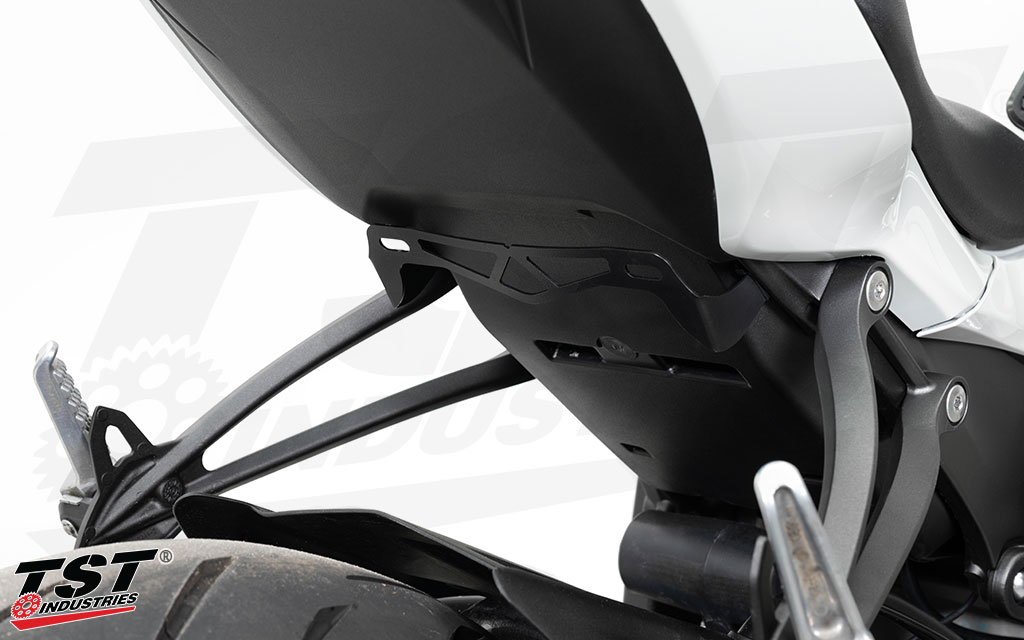 Low mount license plate bracket is manufactured from laser cut stainless steel with a black powder coat finish.