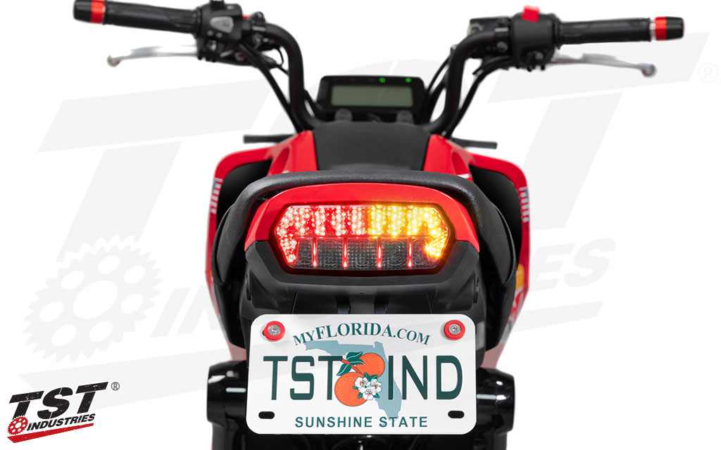 Tail light features built-in turn signals.