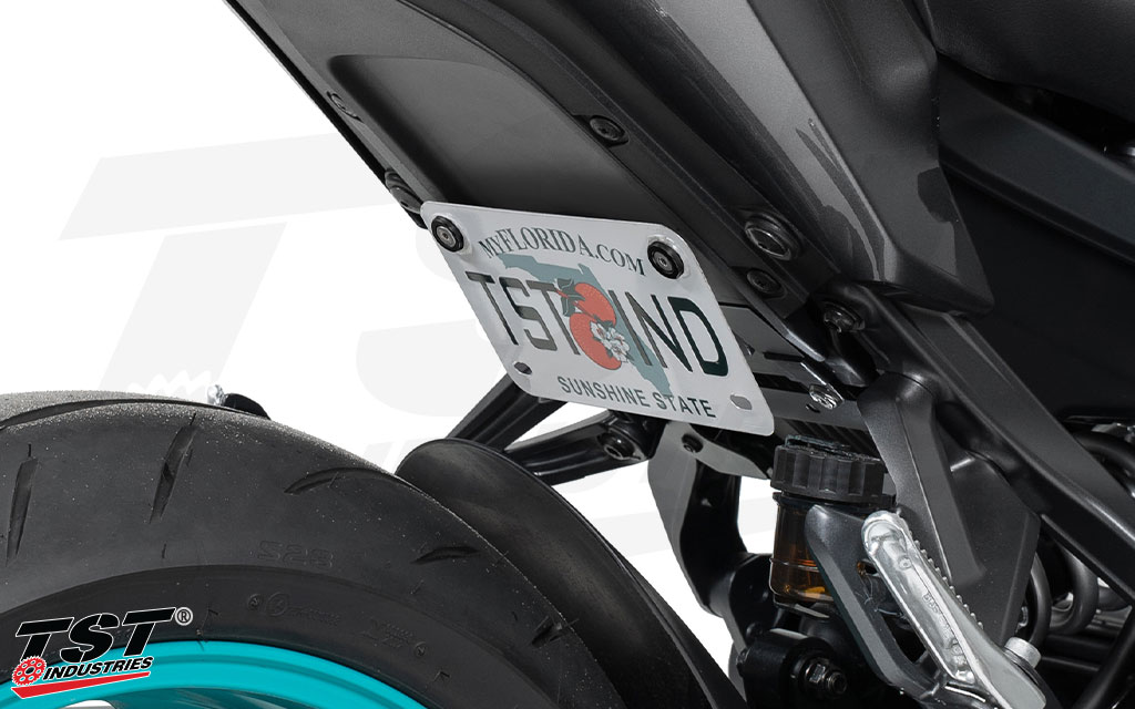 Mounts your MT-09 license plate in a low position tucked under the tail.