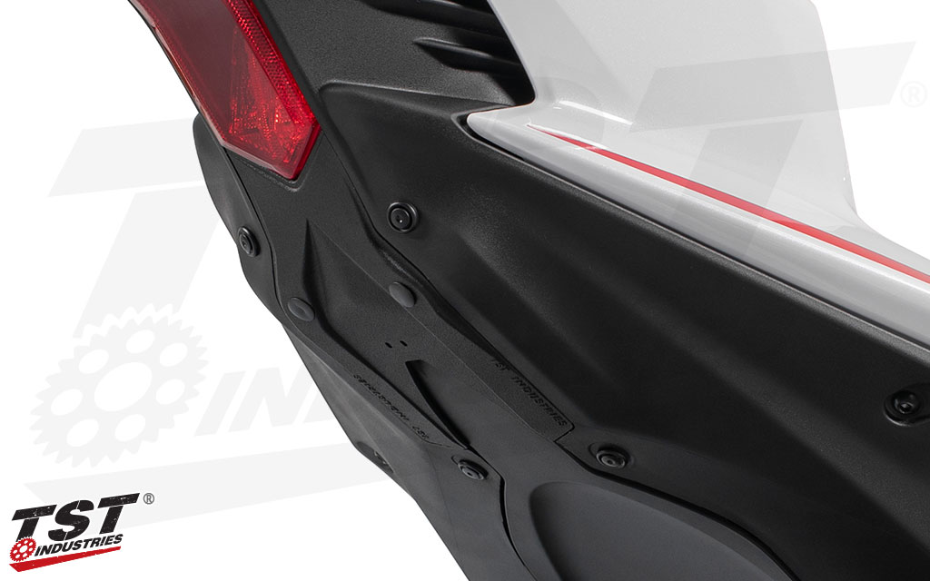 Color and texture matched material blends in with the surrounding OEM tail components.