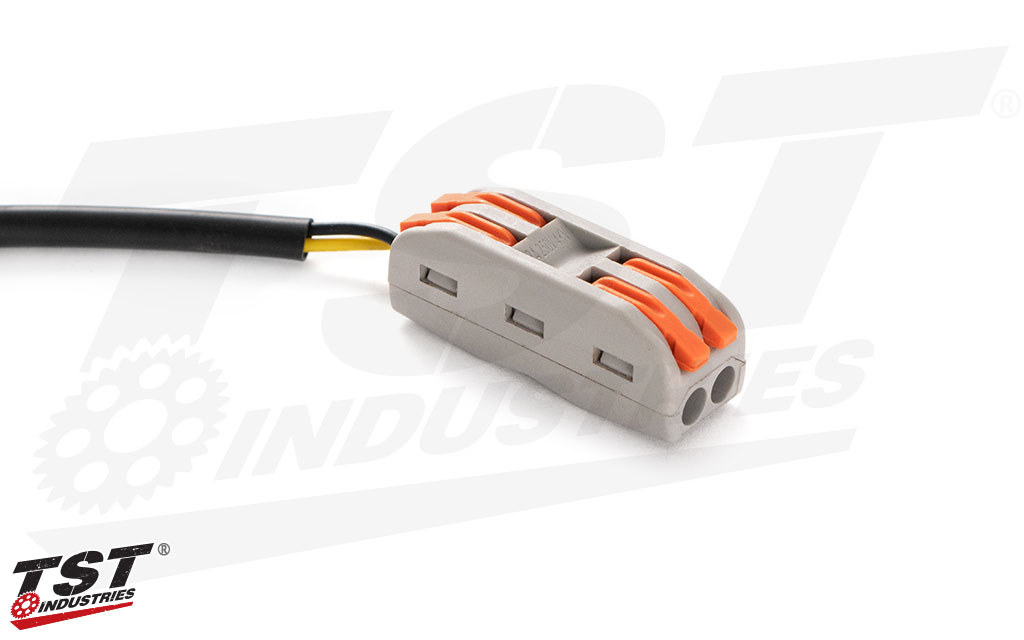 Quick connector plug features easy to use tab connectors.