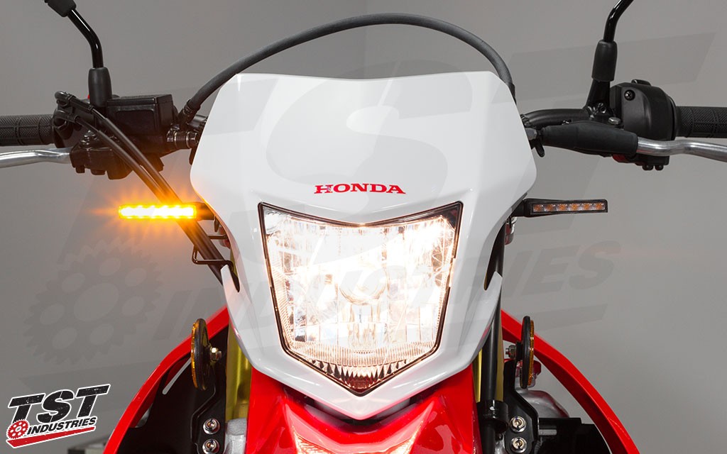 TST LED BL6 clear pod turn signals on the Honda CRF250L.