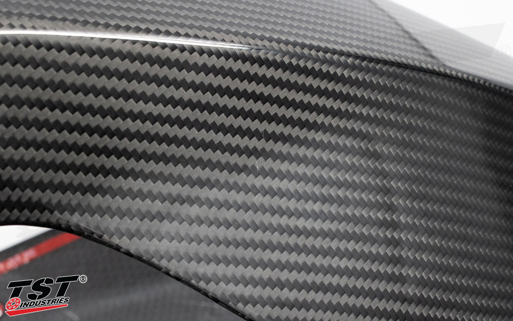 Close-up image of blemish example present on the TST WORX Carbon Fiber Tank Extender.