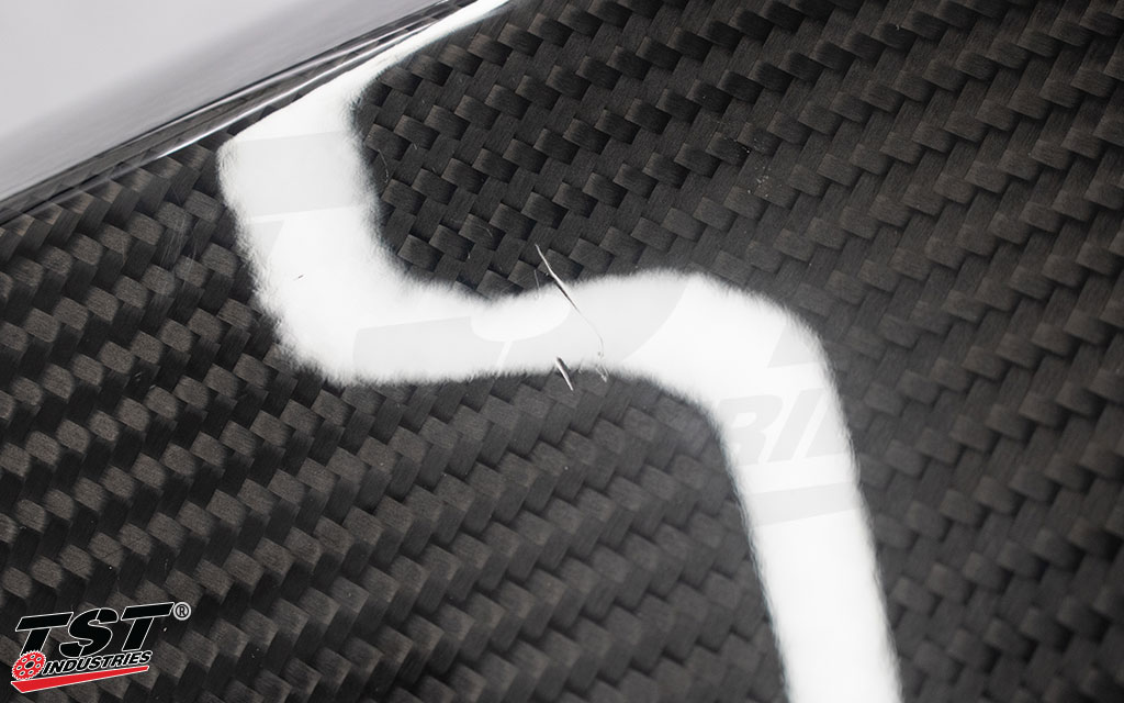 Close-up image of blemish example present on the TST WORX Carbon Fiber Tank Extender.