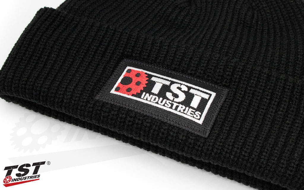 TST embroidered patch located on the fold-over cuff.