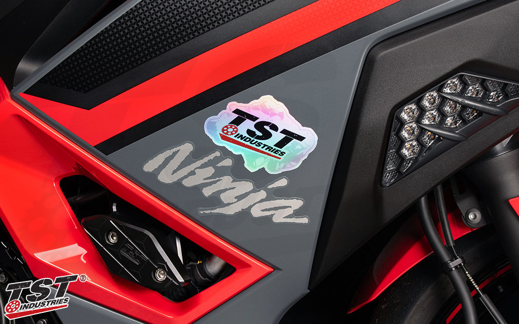 Upgrade your bike with a holographic TST sticker.