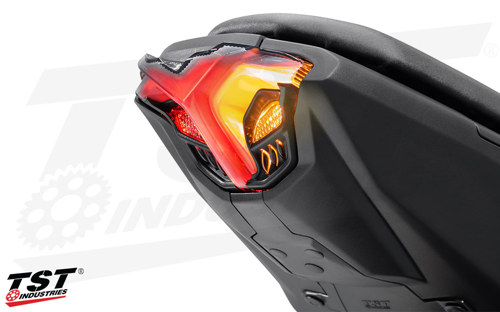 Integrated amber turn signals illuminate during signal activation.