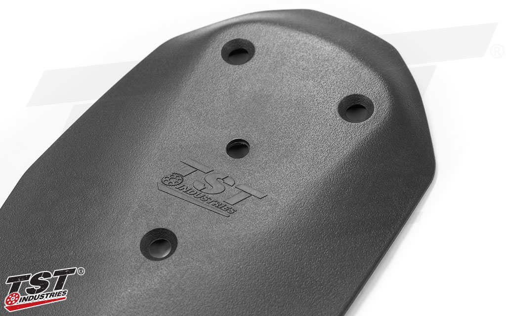 Made from injection-molded plastic that is color and texture matched to the surrounding area.