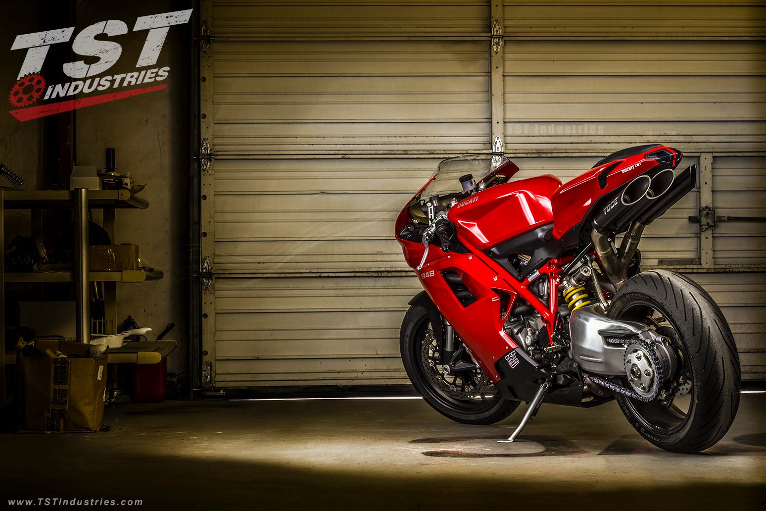 Photoshoot of a red Ducati 848 in the TST Garage with aftermarket parts installed.